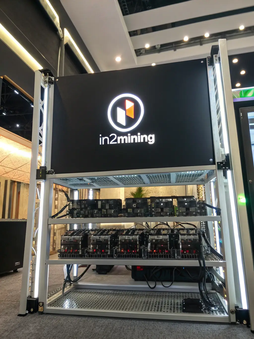 A close-up shot of a WhatsMiner mining rig with a focus on the cooling fans and internal components, highlighting the hardware's robust design and build quality.